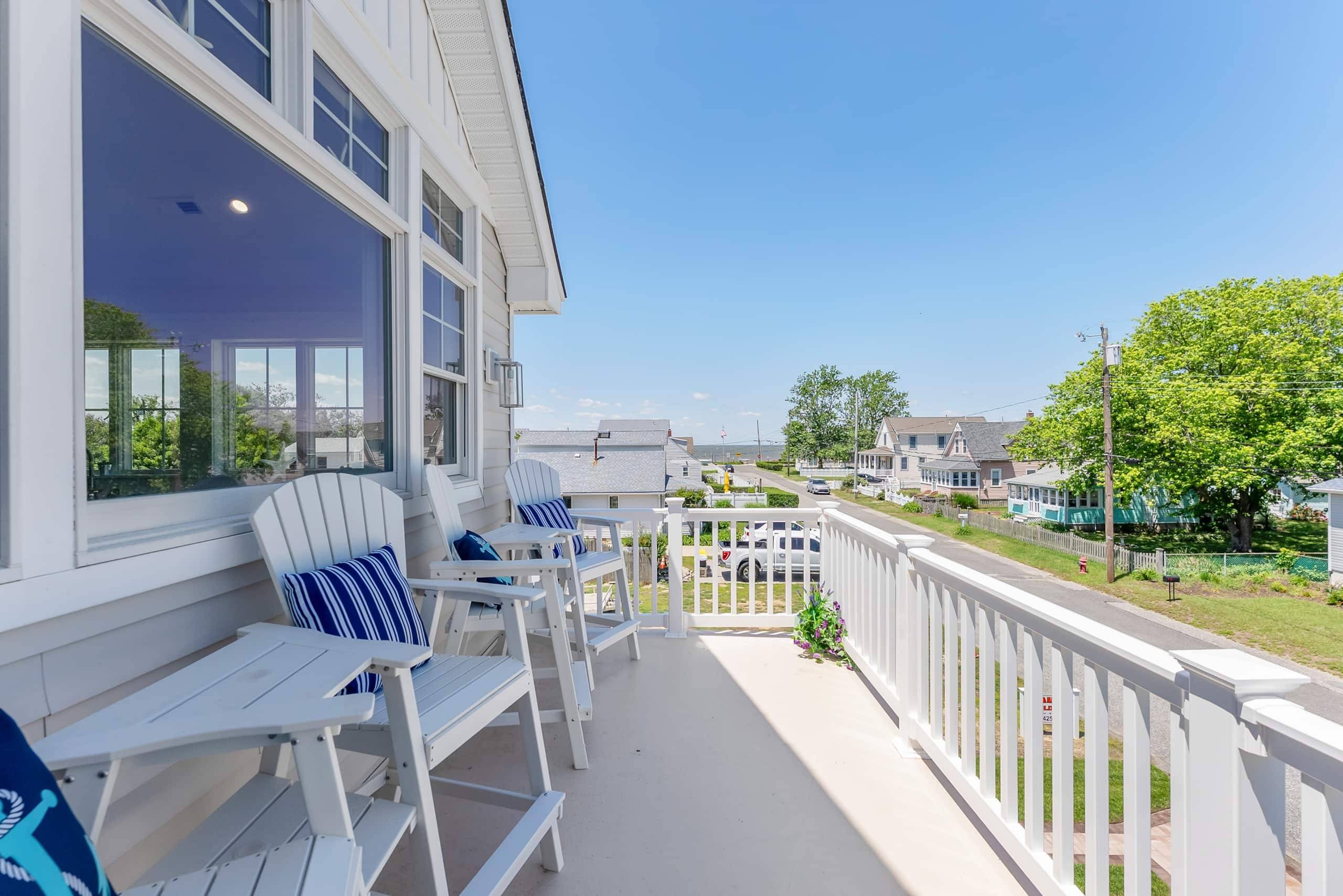 Adirondack chairs on the deck at The Delford, looking toward the Delaware Bay